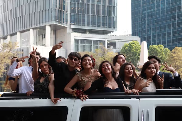 Happy customers enjoying luxury limousine service from cargoworld.pro during a memorable event.